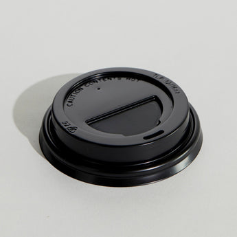 Black coffee cup lid on a white background