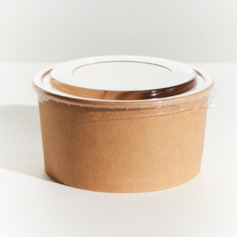 Brown kraft bowl with a clear plastic lid on a white background