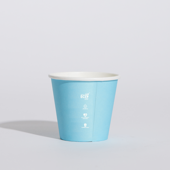 Blue paper cup with a white interior on a light gray background