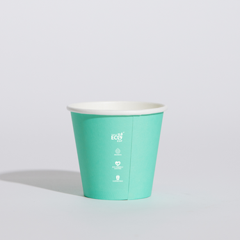 Turquoise paper cup with a white lid on a light gray background