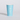 Turquoise paper cup with eco-friendly branding on a light gray background