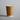 Kraft brown coffee cup with eco logos on a beige backdrop