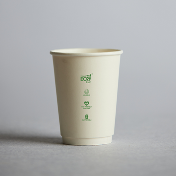 Beige paper cup with green text on a gray background