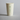 Biodegradable paper cup with eco-friendly branding on a gray background