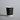 Black paper cup with eco-friendly logos on a gray background